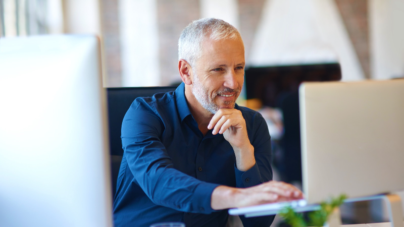entrepreneurial man working in an office at a computer