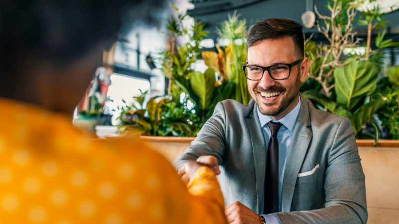 people shaking hands during a job interview
