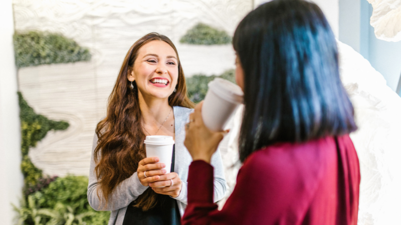 a mentor and mentee chatting over coffee