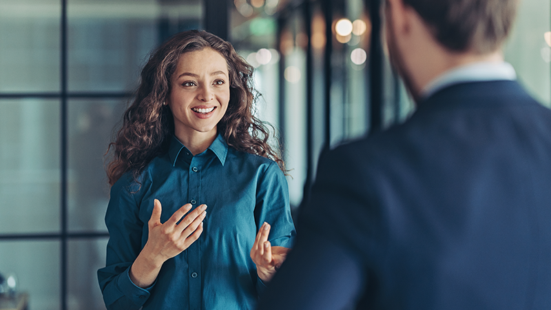 Woman inviting new employee into the organization for onboarding.