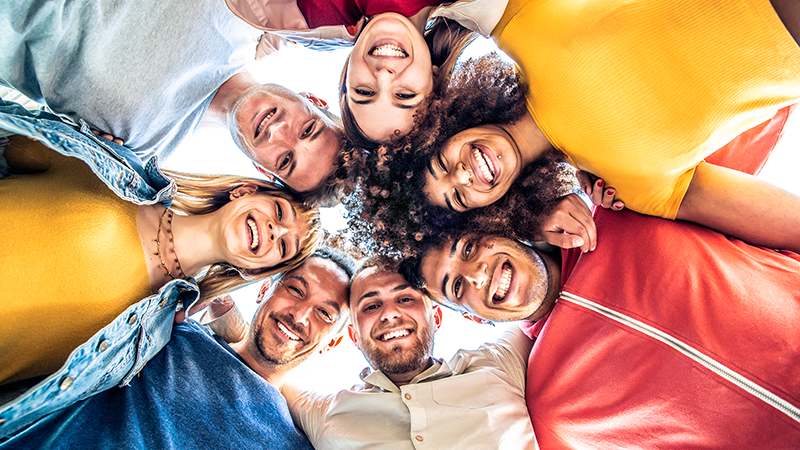 smiling faces of people all in